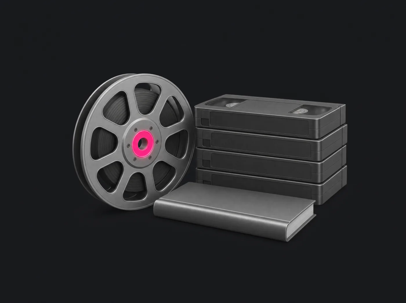 Carrete de película de titanio con el centro rosado junto a estuches de video y un libro